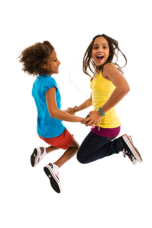 girls dancing and jumping in mid-air