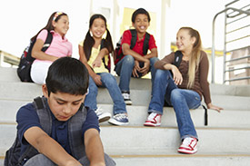 image of a boy being bullied at school