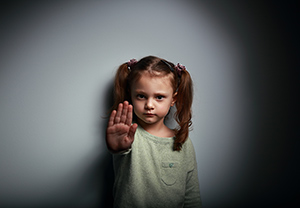 Learning to Say No showing hand signaling to stop