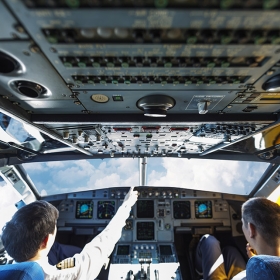 Pilots interacting in a plane cockpit