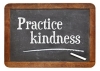 Practice kindness - inspirational advice on a vintage slate blackboard
